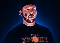 Bronson Zolik narrating the episode, lit in blue